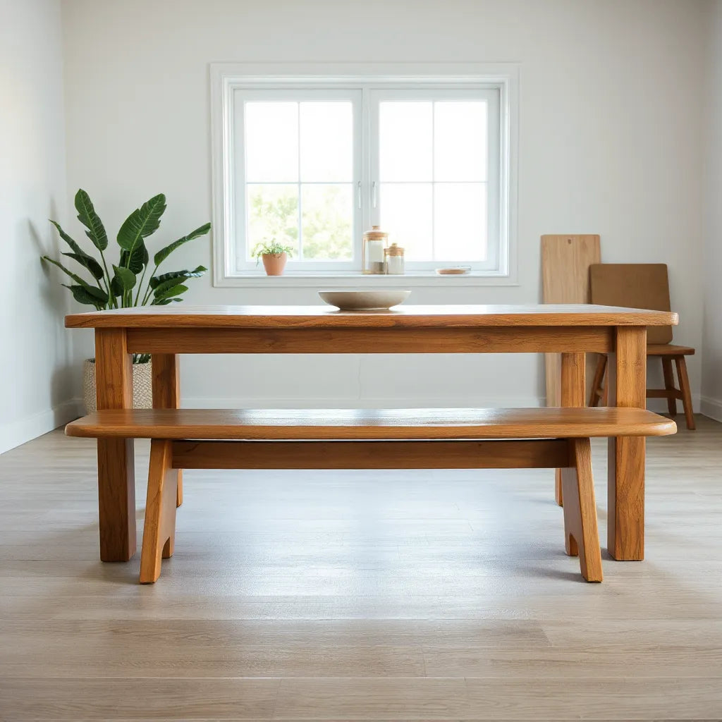Hand-finished solid wood dining table with visible joinery and protective finish in a bright room