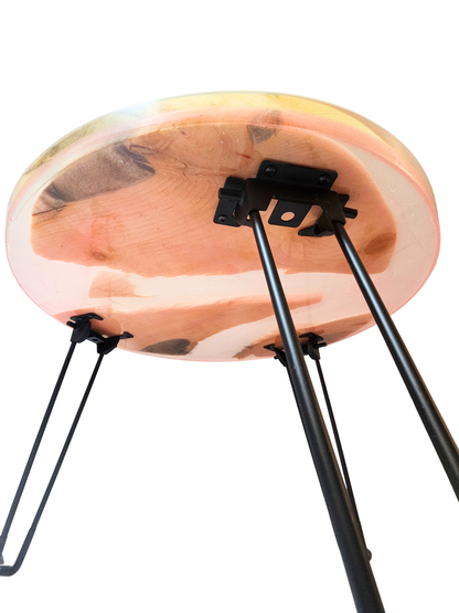 Wooden stool with black metal legs on a white background